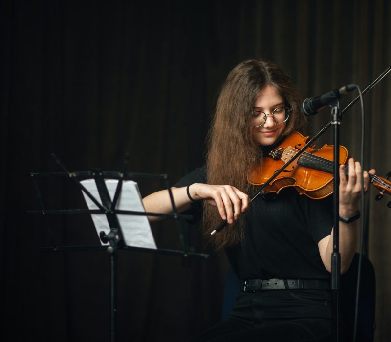 Classical musician playing the violin on stage